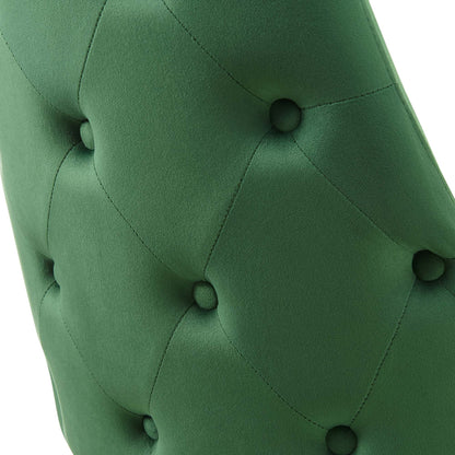 Emerald green tufted upholstery with diamond pattern and fabric-covered buttons.
