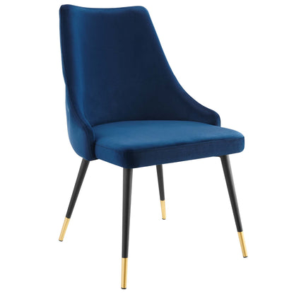 Navy velvet dining side chair with curved back, cushioned seat, and black legs with gold tips.