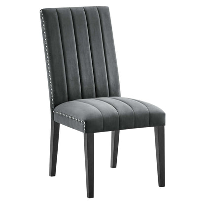 Gray velvet dining chairs with vertical channel tufting, nailhead trim, cushioned seats, and dark tapered legs; set of 2.
