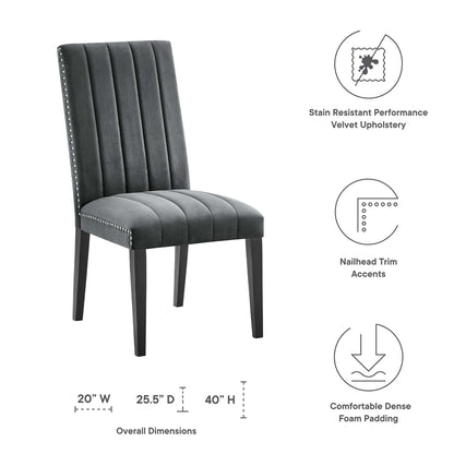 Grey velvet dining side chairs with vertical channel tufting, nailhead trim, dark wood legs; stain-resistant upholstery.