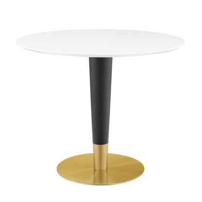 Round white tabletop, black tapered pedestal with gold accent, and gold circular base.