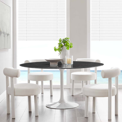 White mid-century round faux-marble dining table with white pedestal base.