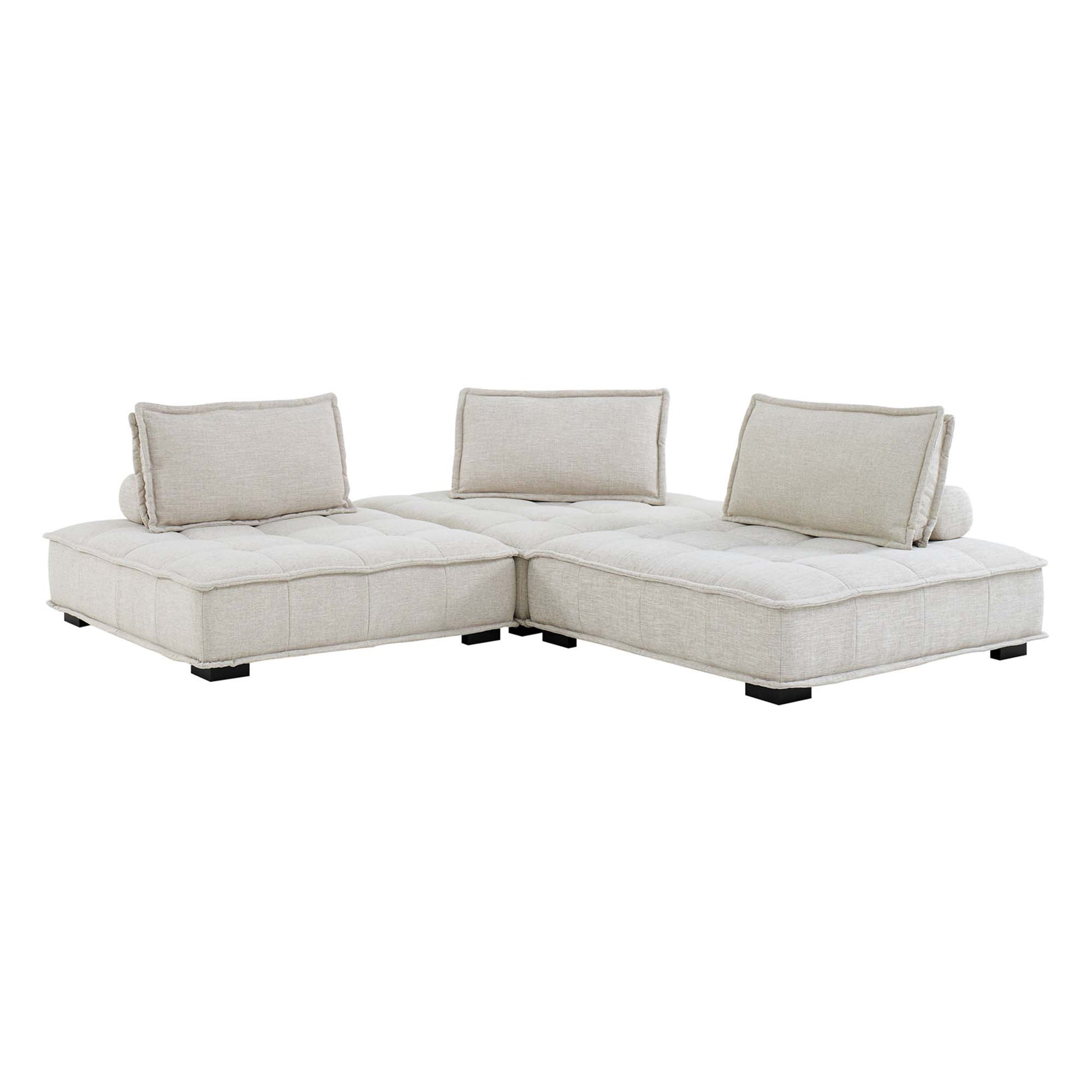 Brown fabric modular L-shaped sectional sofa with tufted cushions and low black legs.