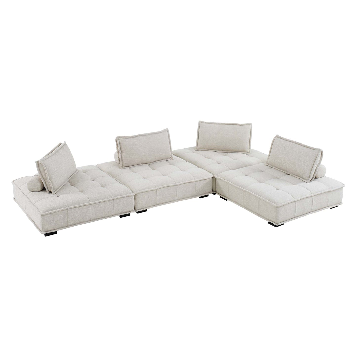 Beige fabric modular sectional sofa in L-shape with tufted cushions, bolster pillows, low legs.