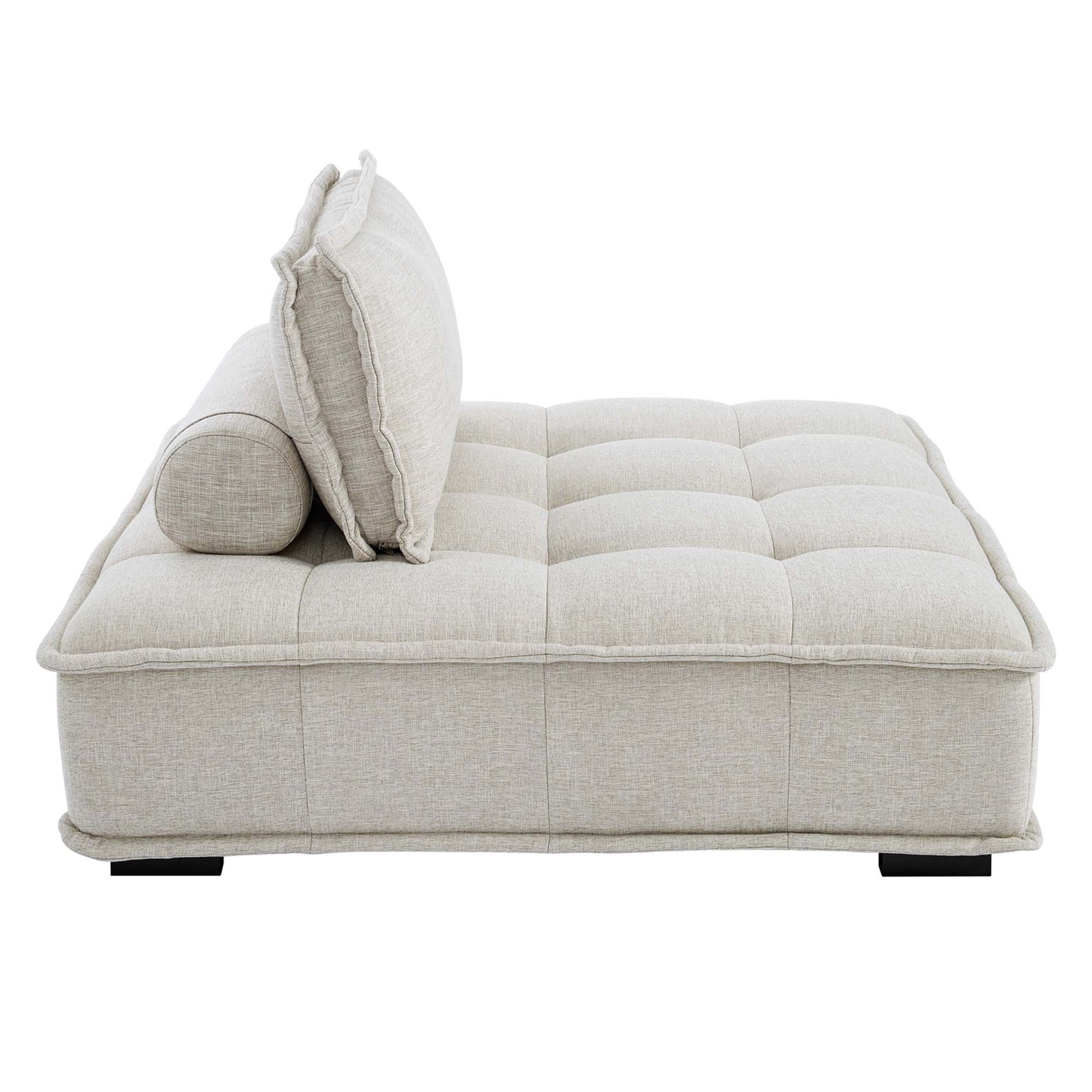 Beige tufted fabric sectional sofa in four pieces with two back cushions and a matching bolster, modern lounge furniture.