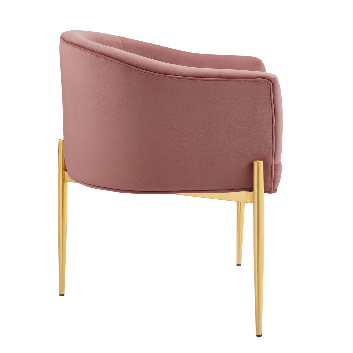 Pink velvet curved barrel chair with gold tapered metal legs, stylish mid-century modern lounge seating.