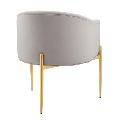 Light gray velvet barrel chair with curved back, gold metal legs, modern glam style.