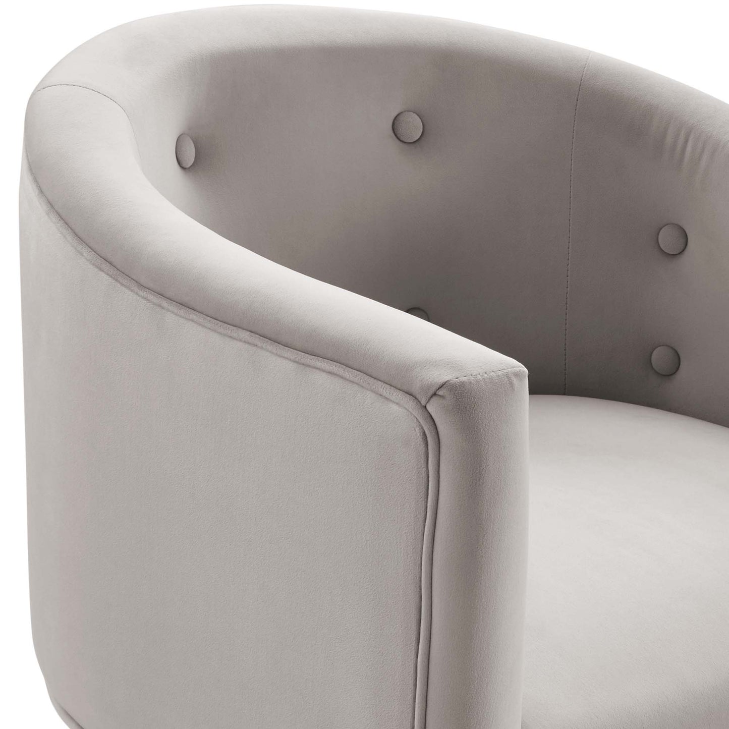 Light gray curved tub chair with button-tufted back and arm, plush soft upholstery for modern lounge seating.