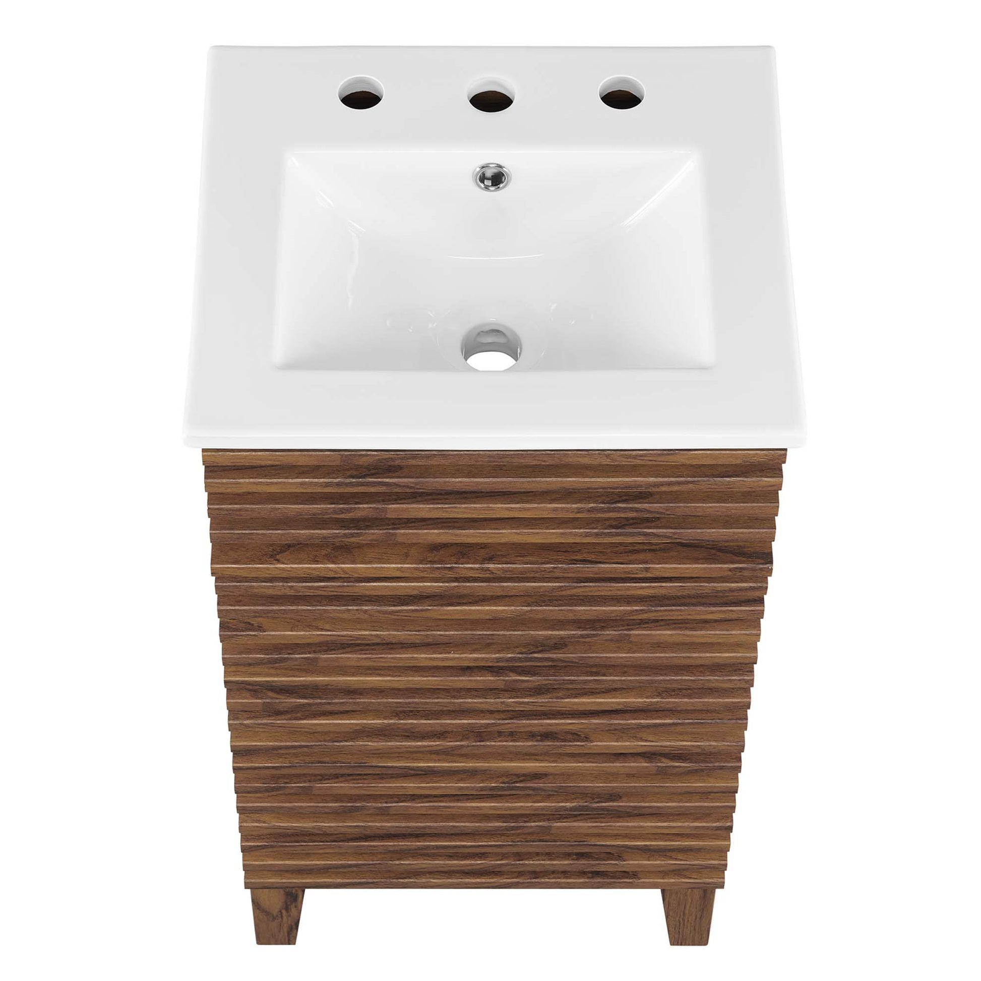 White rectangular ceramic bathroom sink atop a white bathroom vanity cabinet.
