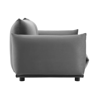 Gray velvet upholstered loveseat with rounded back and short black legs.
