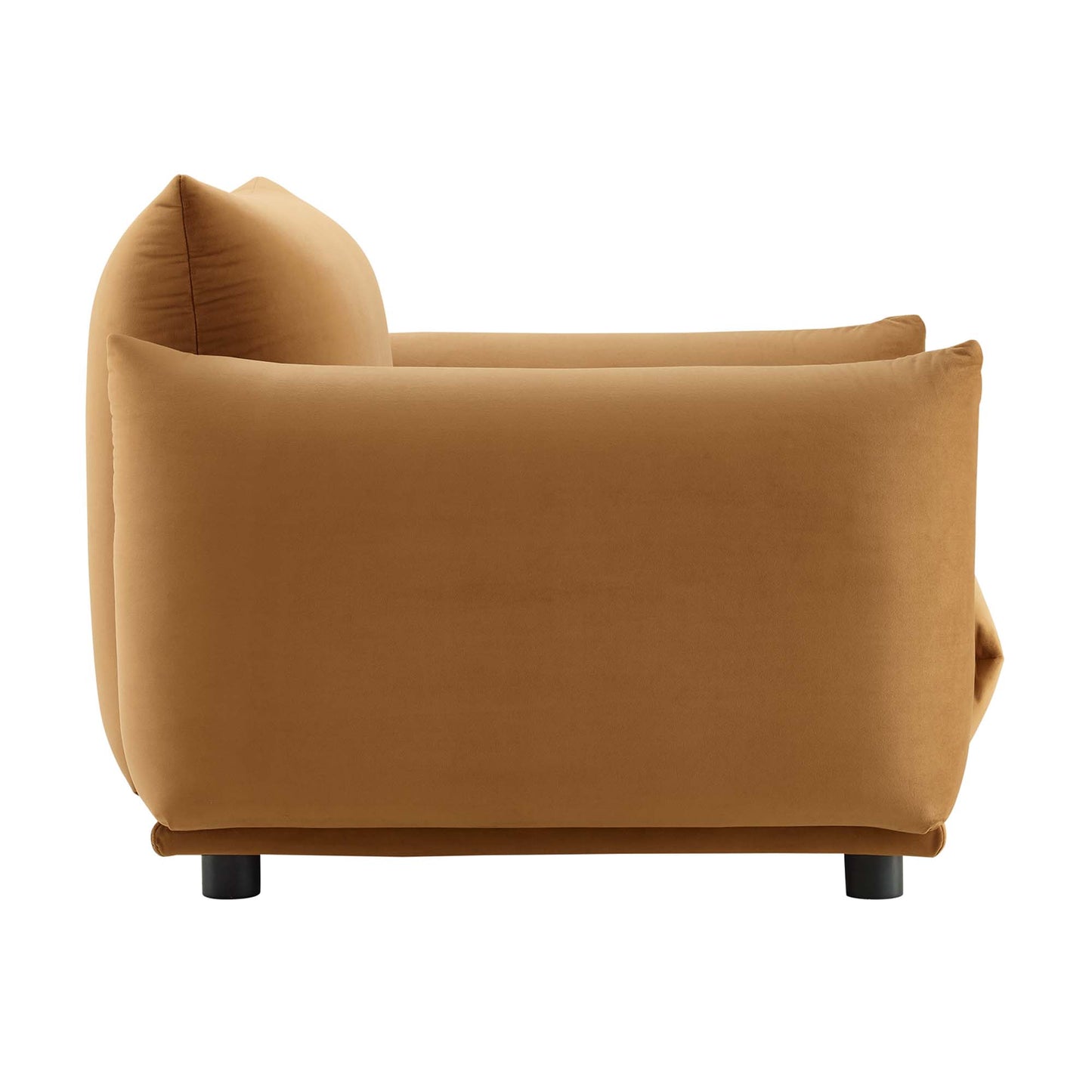 Cognac-brown velvet armchair with rounded back and arms, short black legs, contemporary.