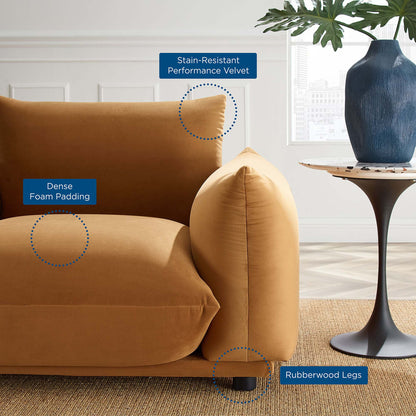 Cognac performance velvet armchair with dense foam padding, stain-resistant velvet, and rubberwood legs in a modern living room.