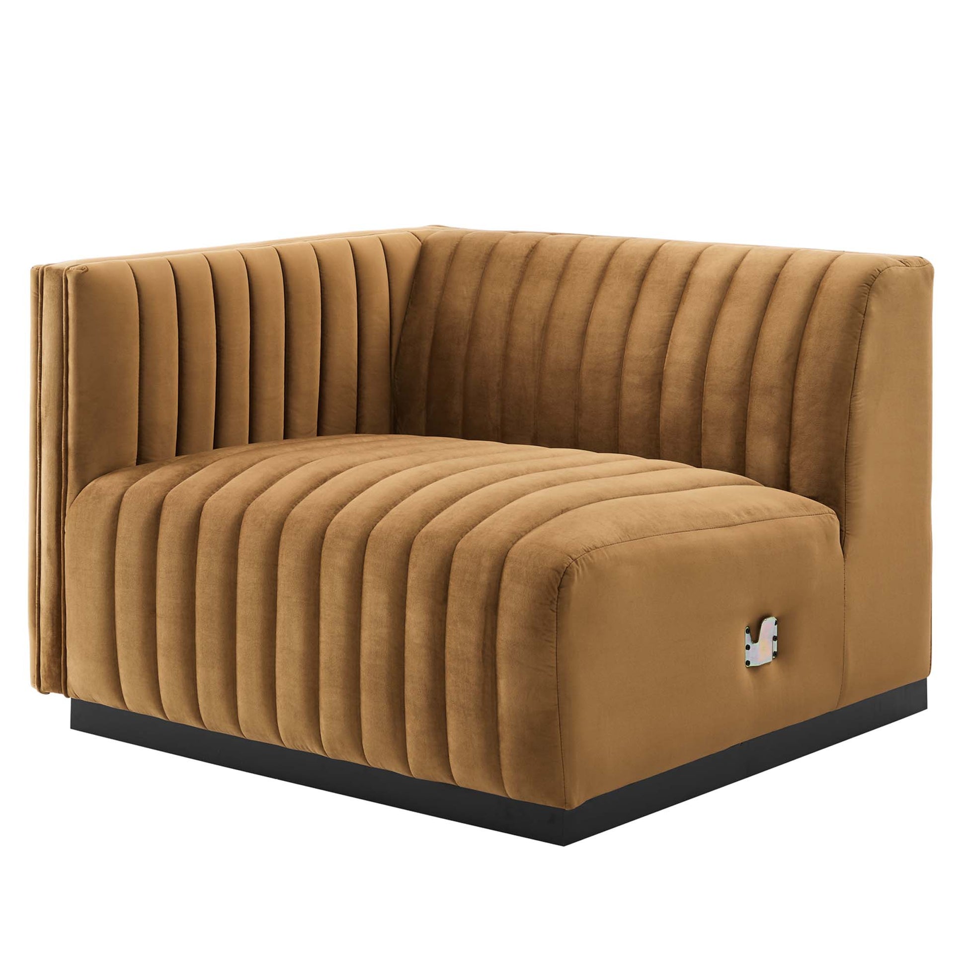 Cognac velvet left-arm chair with vertical channel tufting and a black platform base.