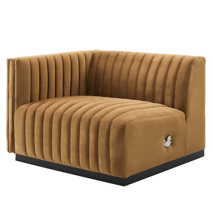 Cognac velvet left-arm chair with vertical channel tufting and a black platform base.