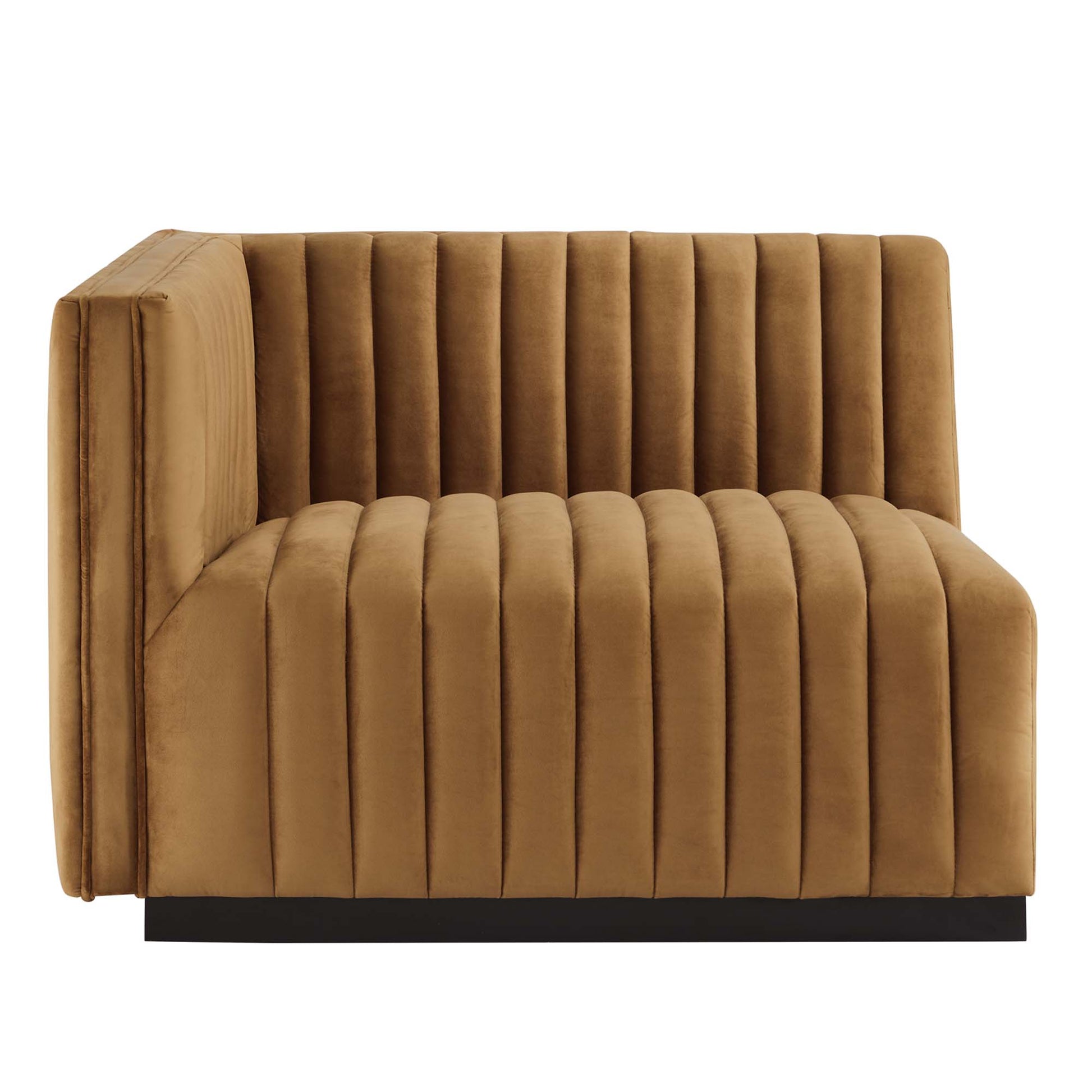 Cognac velvet channel-tufted left-arm chair with low back and black base.
