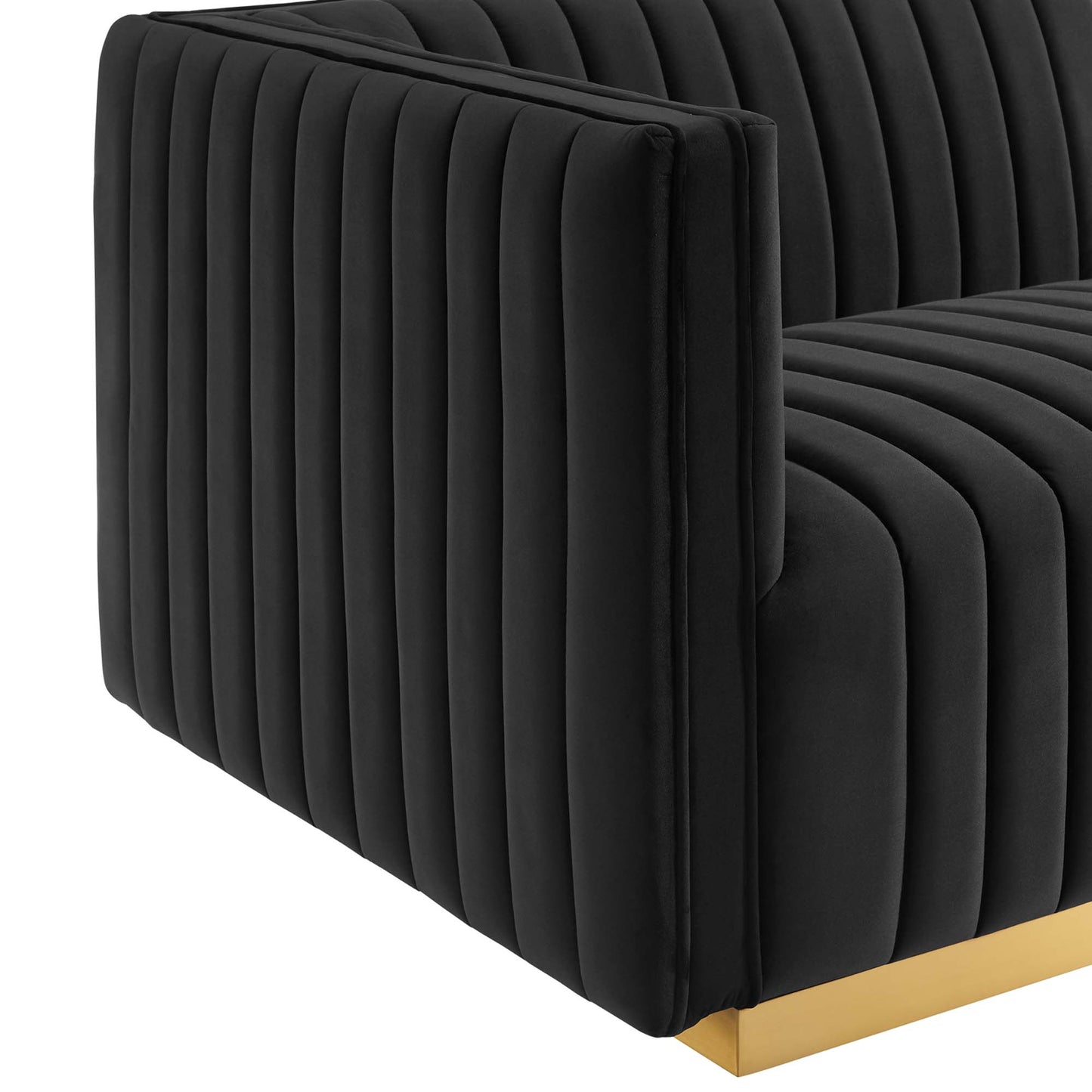 Black velvet channel-tufted left-arm chair with a gold metal base.