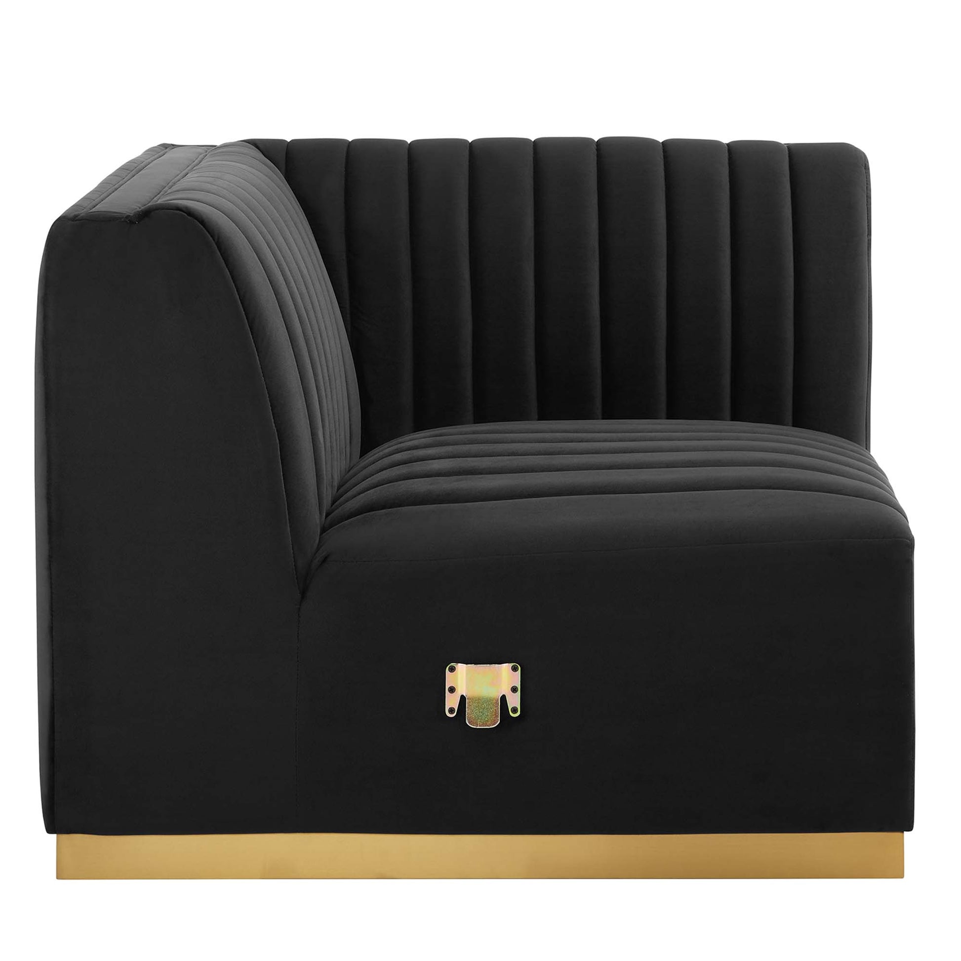 Black velvet right corner chair with gold base, vertical channel tufting, curved right arm, modern luxe style.