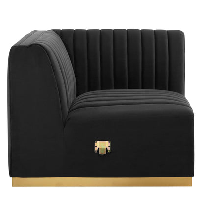 Black velvet right corner chair with gold base, vertical channel tufting, curved right arm, modern luxe style.