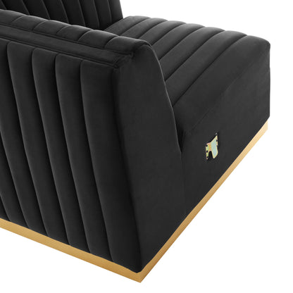 Black velvet upholstered right corner chair with vertical channel tufting and a gold-tone base.