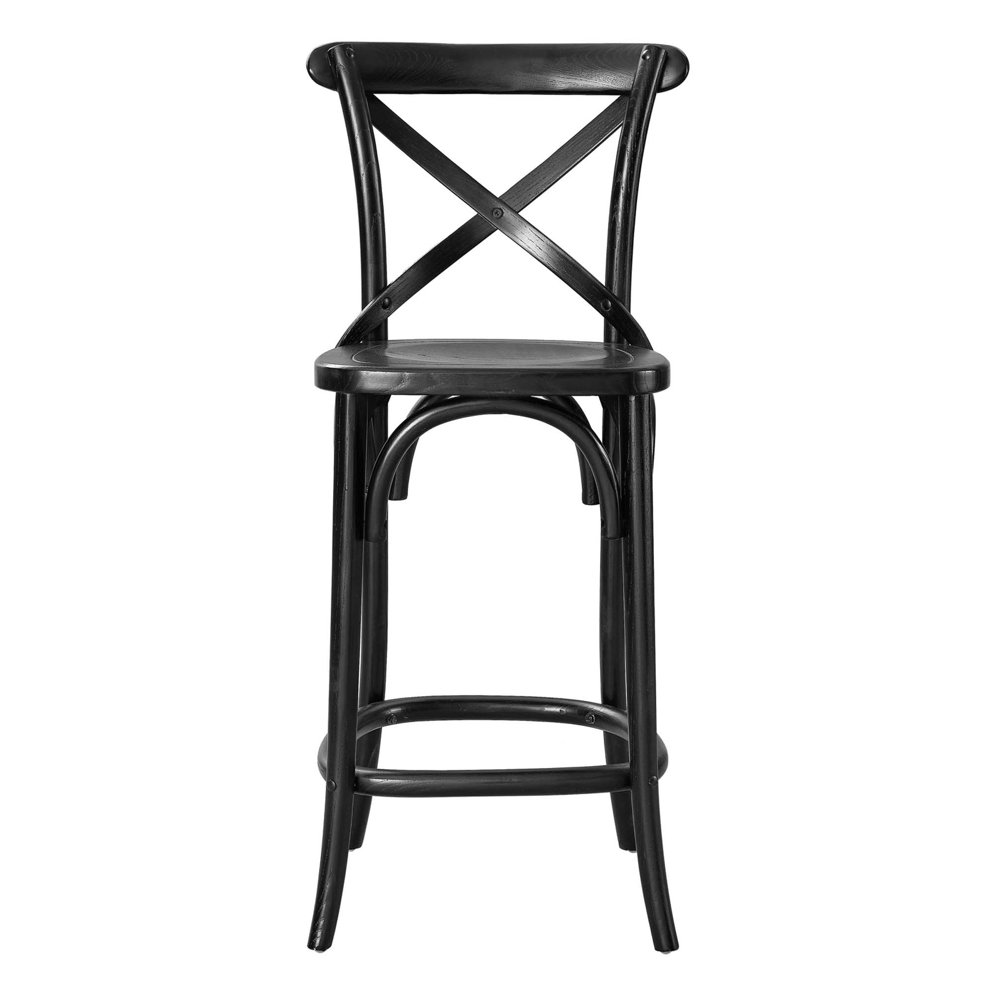 Black metal bar stool with an X-back, round seat, and curved legs with a footrest.
