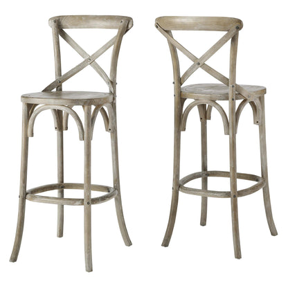 Pair of gray weathered wooden bar stools with round seats, X-back, arched legs and footrest ring
