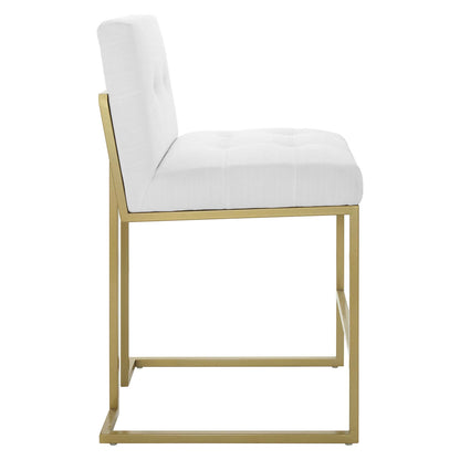 White upholstered tufted counter stools with a gold-tone metal cantilever frame; set of 2.