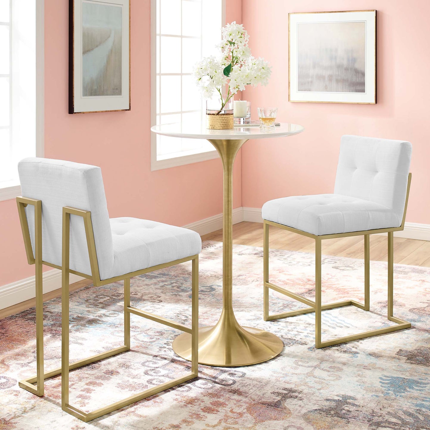 Gold metal counter stools set of 2 with white upholstered seats, shown in a pink-walled room.