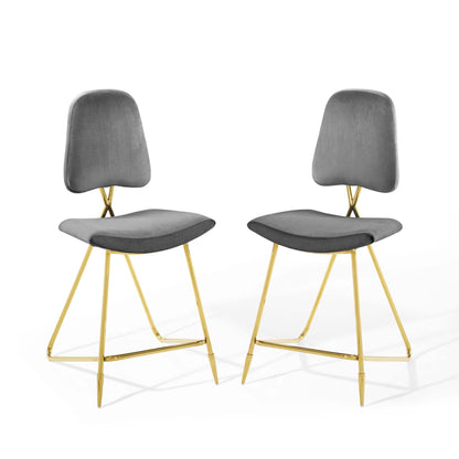 Pair of gray upholstered counter stools with gold-tone metal legs and crossbar footrest.