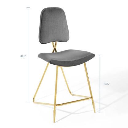 Grey upholstered counter stools with gold-tone metal sled legs, curved backs and cushioned seats. Set of 2.