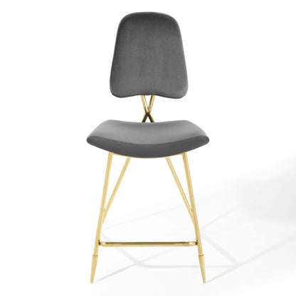 Gray velvet padded counter stool with curved back, gold-tone legs and footrest.