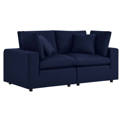 Navy blue fabric loveseat with square arms, two-seat cushions, multiple back cushions and short black legs.