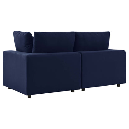 Navy blue fabric outdoor patio loveseat with squared arms and low-profile legs.