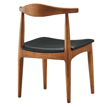 Mid-century wooden dining side chair with black leatherette cushion, curved backrest and tapered legs.