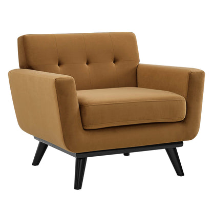 Caramel brown fabric armchair, mid-century modern, tufted back, wide arms, thick seat cushion, black angled legs.