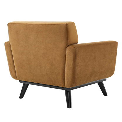 Cognac velvet armchair with square arms and black angled legs, mid-century modern lounge seating.