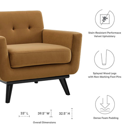 Cognac velvet mid-century armchair with tufted back & armrests, dense foam cushions, black splayed wood legs.