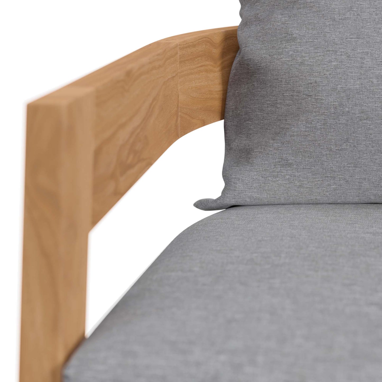 Teak wood outdoor patio armchair with gray cushions; close-up of armrest and seat.