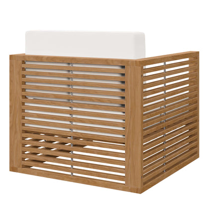 Teak wood outdoor armchair with slatted sides and a white cushion.