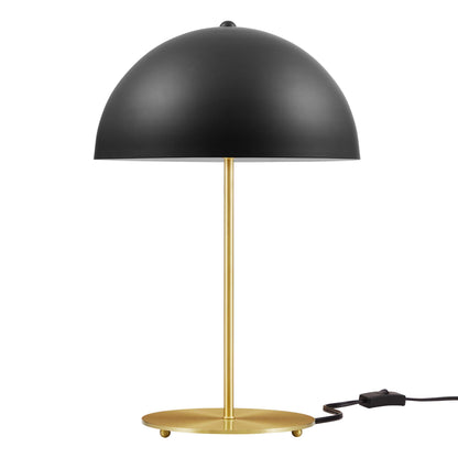 Black dome shade on brass gold stem with round base; corded modern desk lamp.