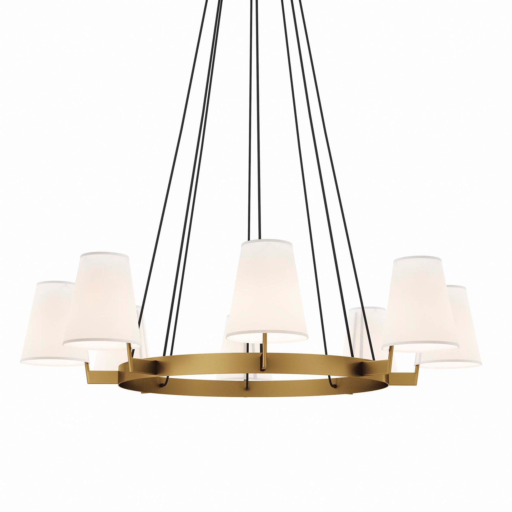 Gold circular chandelier with white drum shades & black suspension cords.
