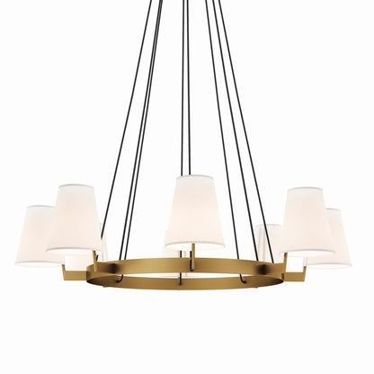 Gold circular chandelier with white drum shades & black suspension cords.