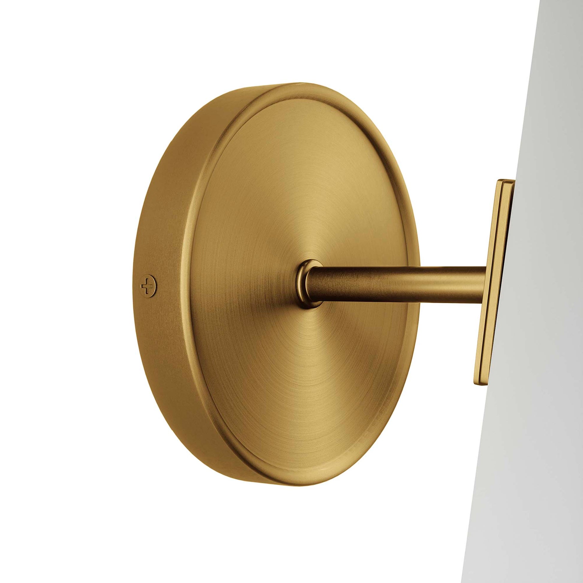 Satin clear brass wall sconce with a round backplate and a cylindrical clear glass shade, one-light.