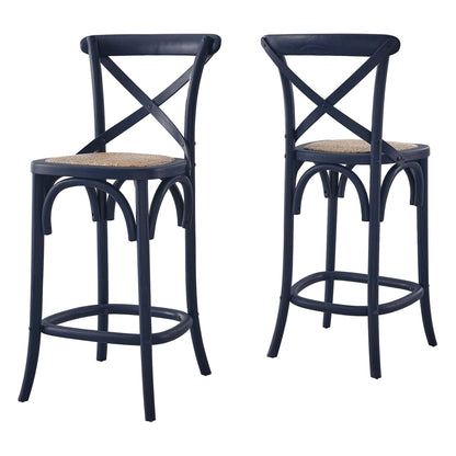 Pair of navy blue metal counter stools with woven cane seats, X-back, curved legs and circular footrest.
