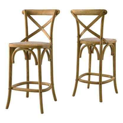 Two natural-finish rattan counter stools with woven cane seats, X-back, curved legs and circular footrests.