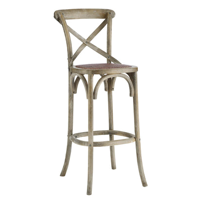 Rustic weathered gray wood bar stool with X-back, curved arch supports, circular footrest and gray upholstered seat