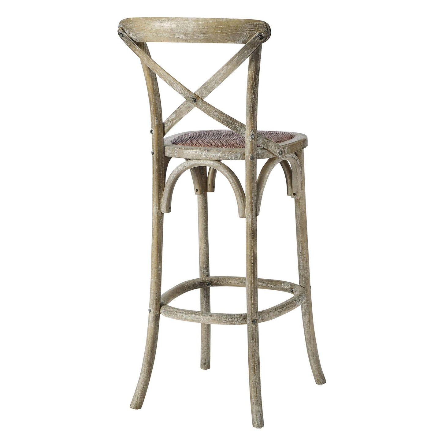 Rustic gray-washed wood bar stool with cross-back X design, upholstered woven seat, and curved legs with a footrest ring.