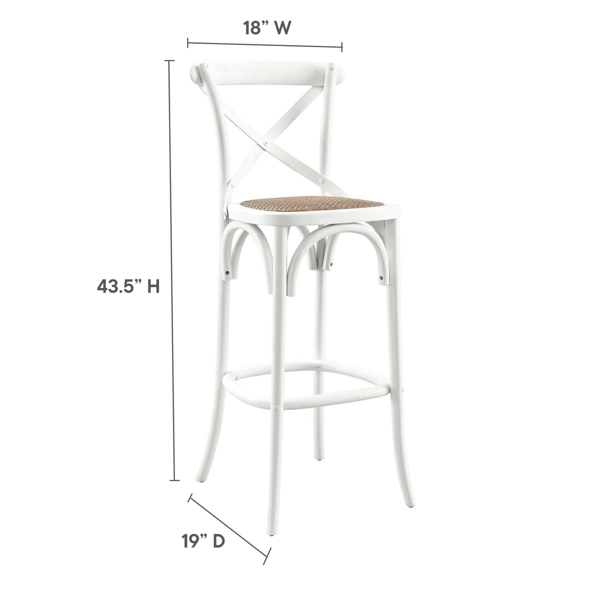 White metal bar stool with a woven natural cane seat, X-back, curved legs and circular footrest for kitchen counter use.