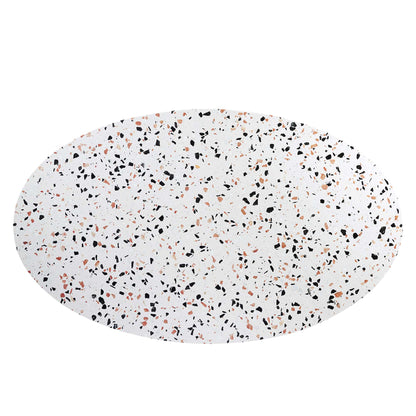 Oval white terrazzo-pattern dining table with black, tan and orange specks, 60-inch long.