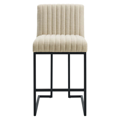 Brown upholstered counter stool with vertical channel tufting & black metal frame, rectangular footrest.