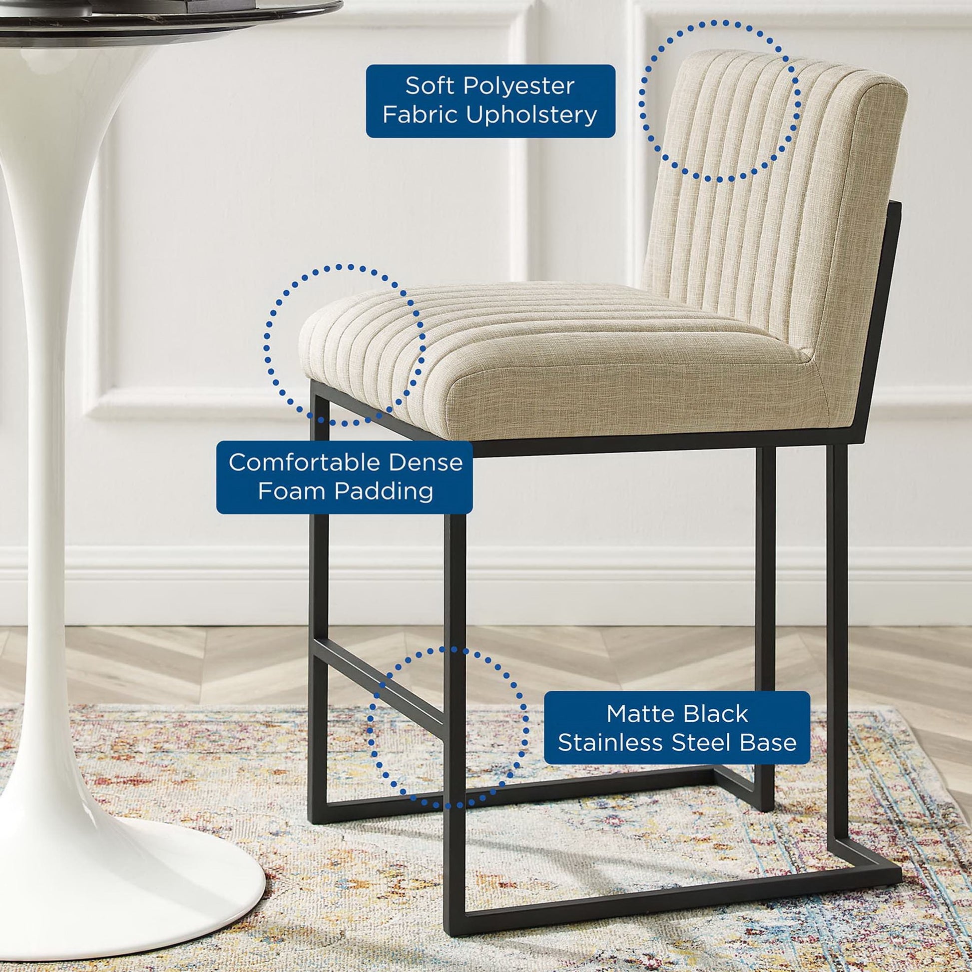 Beige ribbed fabric upholstered bar stool with dense foam padding and matte black stainless steel frame with footrest.